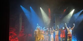 The cast of Mythos Ragnarok bracing for a bow at the end of the show