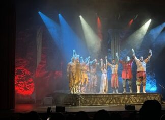 The cast of Mythos Ragnarok bracing for a bow at the end of the show